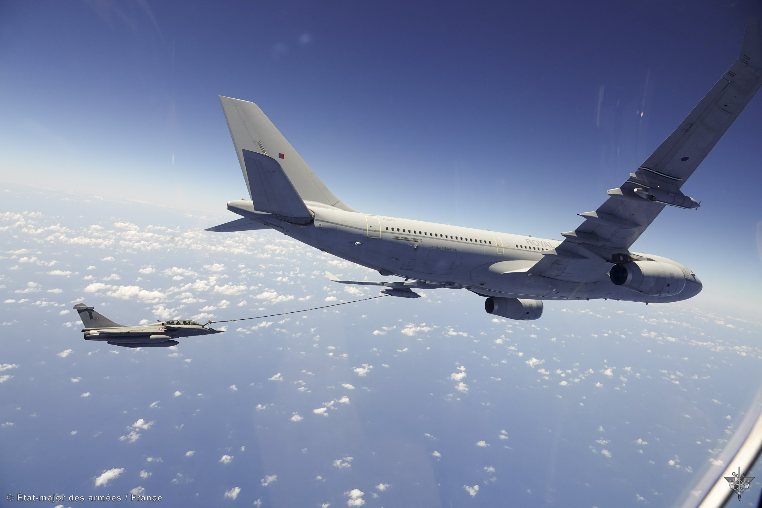 Image shows RAF Typhoon refuelling RAF Voyager in the air.